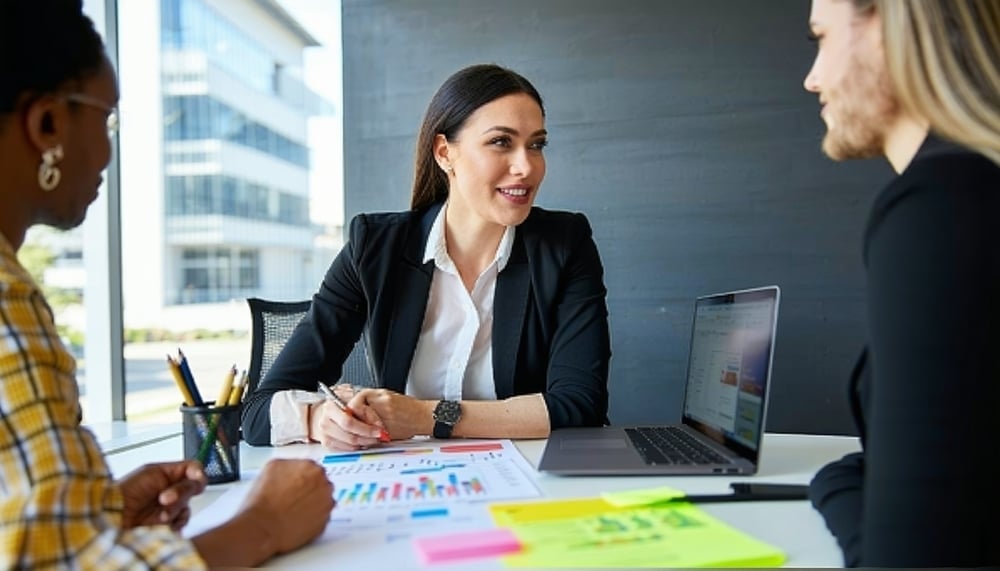 Business coach guiding a small business owner through a sales strategy discussion